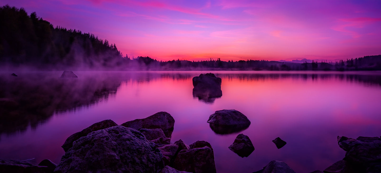 Sunset over a misty lake - Panorama